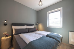 Appartement_Alpenrose_Schlafzimmer_Feriendorf_Wall