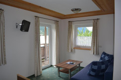 Zimmer 4 - Sitzecke mit einem Zusatzbett Zimmer 4 - Sitzecke mit einem Zusatzbett